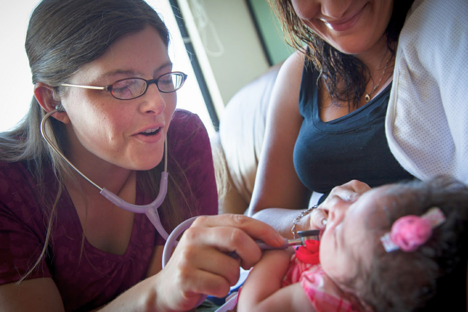 Dr. Robin caring for patients in her safety net clinic for uninsured and underinsured patients in Englewood Colorado