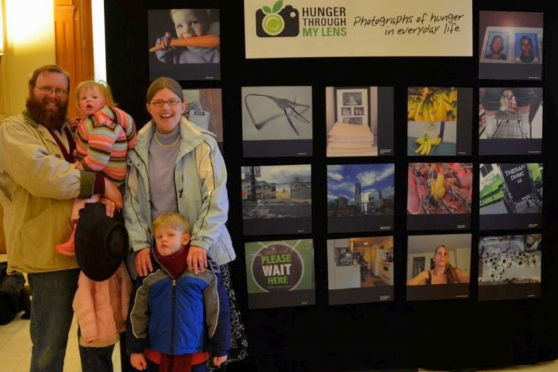 Dr. Robin Dickinson, Volunteer speaker and advocate for Hunger Free Colorado, pictured with her family at an exhibit on hunger at the state capitol